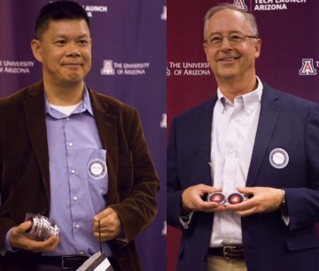 Stanley Pau (left) and Dean Tom Koch (right) Receive their TLA Commemorative Coins