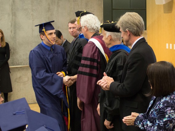 2015 Winter Commencement Students Shaking Hands with Board